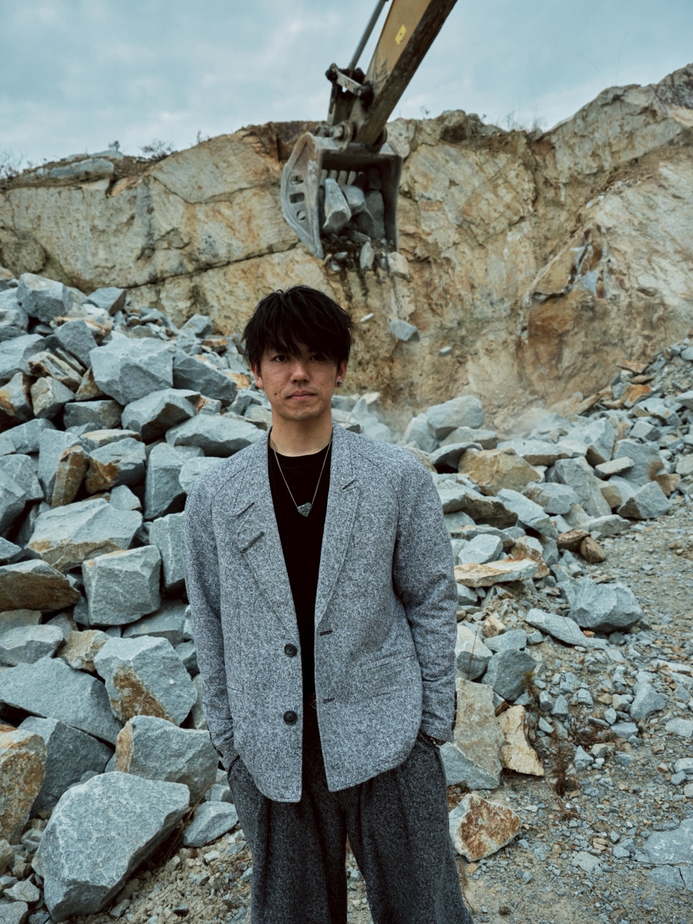 Kyohei Tabuchi wearing a stone-patterned jacket at the quarry